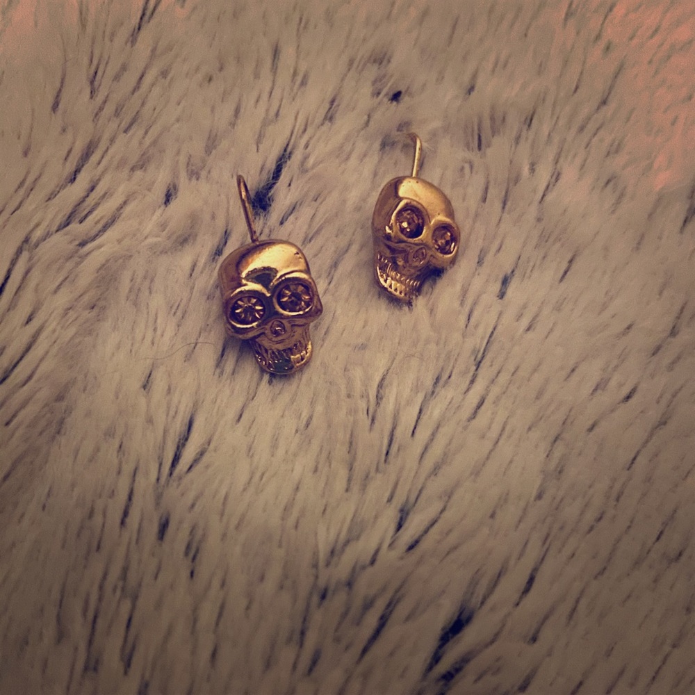Betsy Johnson gold skull earrings.